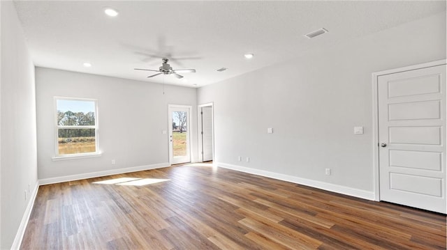empty room featuring ceiling fan, recessed lighting, baseboards, wood finished floors, and visible vents