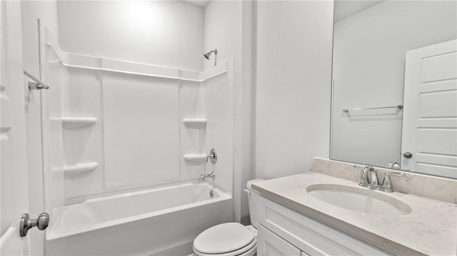 bathroom with toilet, shower / bath combination, and vanity