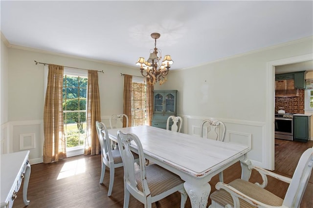 608 Montclaire Way, Mobile, AL 36609 - dining space featuring a chandelier, wainscoting, crown molding, dark wood-style floors, and a decorative wall