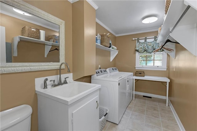 608 Montclaire Way, Mobile, AL 36609 - laundry area with independent washer and dryer, ornamental molding, baseboards, and light tile patterned floors