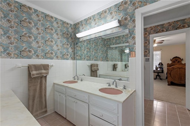 608 Montclaire Way, Mobile, AL 36609 - bathroom featuring wallpapered walls, double vanity, ornamental molding, tile patterned floors, and wainscoting