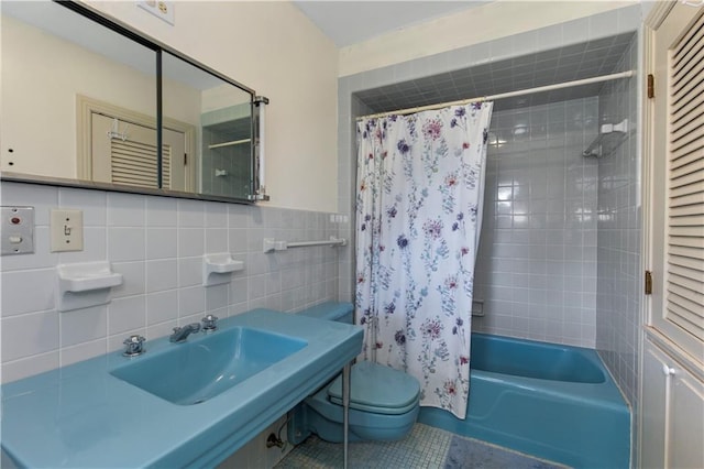 608 Montclaire Way, Mobile, AL 36609 - bathroom featuring a sink, toilet, shower / bath combination with curtain, tile walls, and tile patterned floors