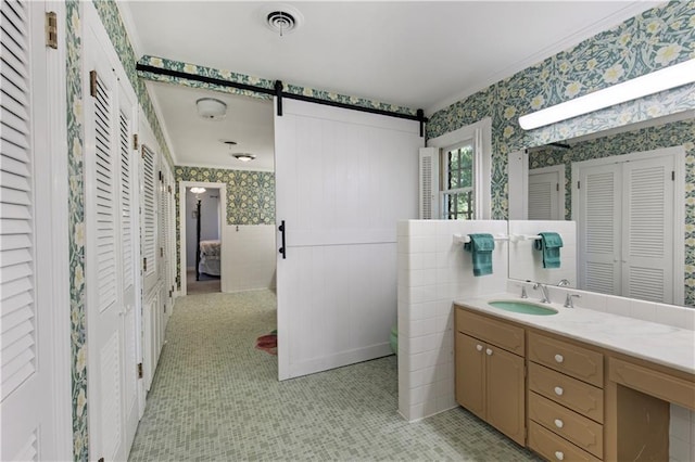 608 Montclaire Way, Mobile, AL 36609 - full bath with wallpapered walls, a closet, crown molding, vanity, and a wainscoted wall