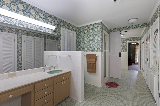 608 Montclaire Way, Mobile, AL 36609 - full bath featuring a closet, wallpapered walls, crown molding, vanity, and a wainscoted wall