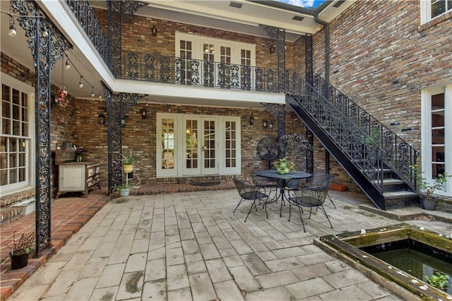 608 Montclaire Way, Mobile, AL 36609 - view of patio / terrace with french doors and stairway