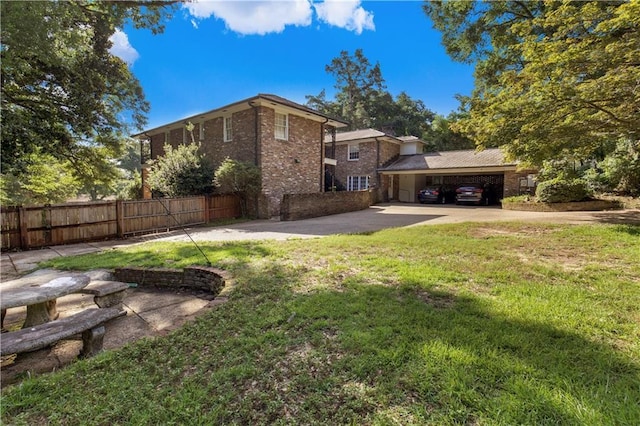 608 Montclaire Way, Mobile, AL 36609 - back of house featuring driveway and brick siding