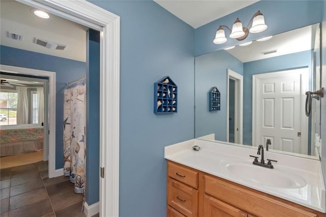 9102 Magnolia Ct, Spanish Fort, AL 36527 - bathroom with vanity, baseboards, and tile patterned floors