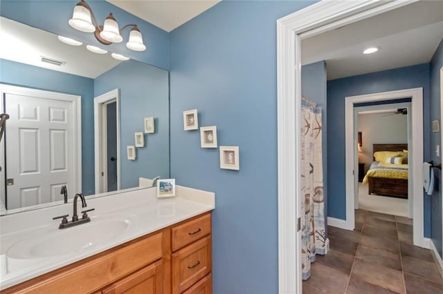 9102 Magnolia Ct, Spanish Fort, AL 36527 - full bathroom featuring vanity, tile patterned flooring, ensuite bathroom, baseboards, and a shower with shower curtain