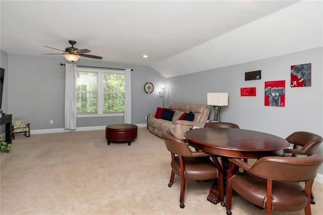 9102 Magnolia Ct, Spanish Fort, AL 36527 - dining space featuring a ceiling fan, vaulted ceiling, light colored carpet, and baseboards