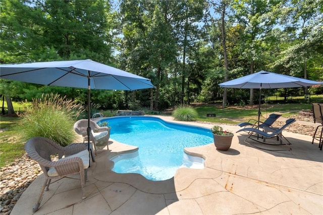9102 Magnolia Ct, Spanish Fort, AL 36527 - swimming pool with a patio area and view of scattered trees