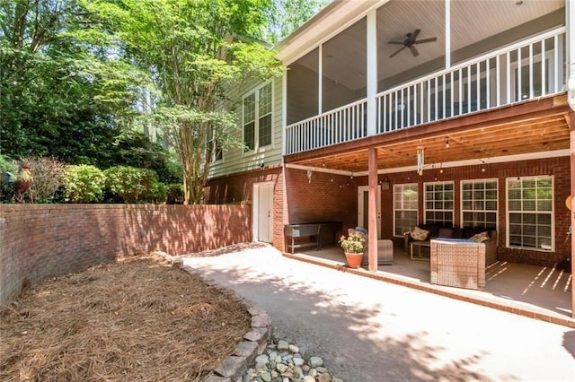 9102 Magnolia Ct, Spanish Fort, AL 36527 - back of house featuring a patio area, ceiling fan, brick siding, a sunroom, and an outdoor hangout area