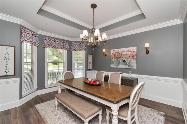 9102 Magnolia Ct, Spanish Fort, AL 36527 - dining area featuring a tray ceiling, a chandelier, wood finished floors, baseboards, and crown molding