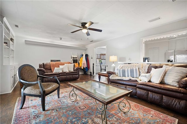 living area featuring wood finished floors and ceiling fan