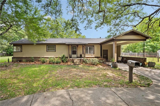 ranch-style home with an attached carport and concrete driveway