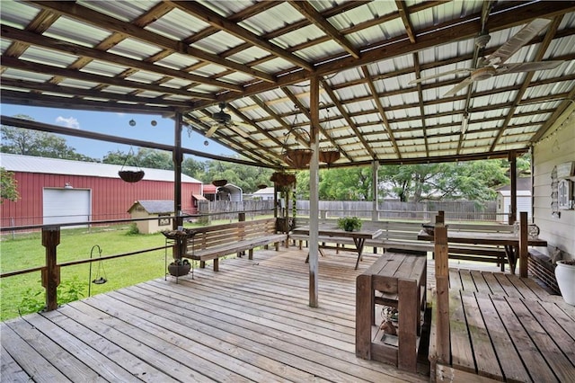wooden terrace featuring an outbuilding