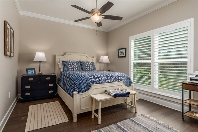 bedroom with dark wood-style floors, baseboards, ornamental molding, and ceiling fan