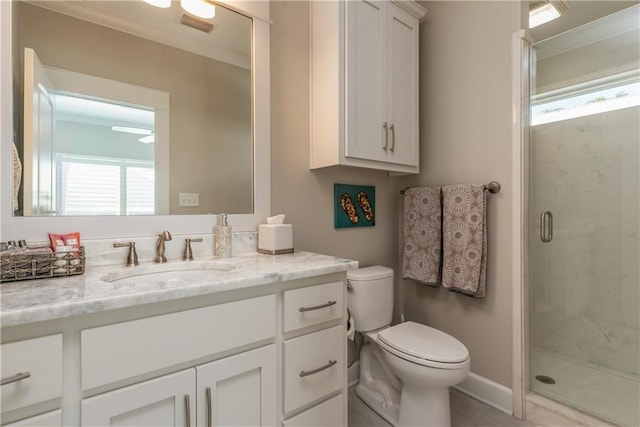 bathroom featuring visible vents, a stall shower, vanity, and toilet