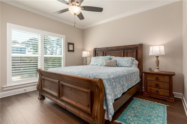 bedroom featuring ornamental molding, dark wood-style flooring, baseboards, and a ceiling fan