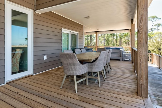 wooden terrace featuring outdoor dining space