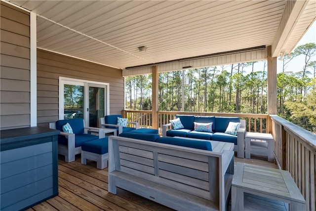 wooden terrace featuring an outdoor living space