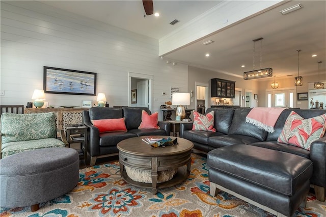 living area with visible vents and recessed lighting