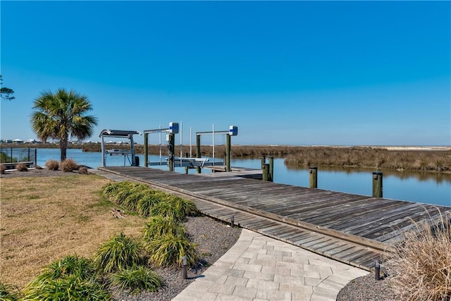 view of dock with a water view and boat lift