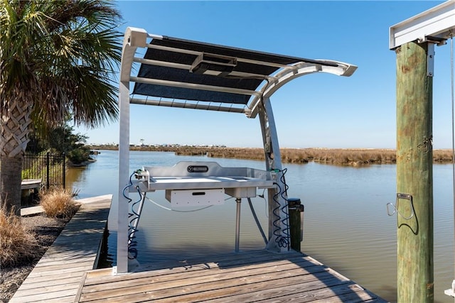 dock area featuring a water view