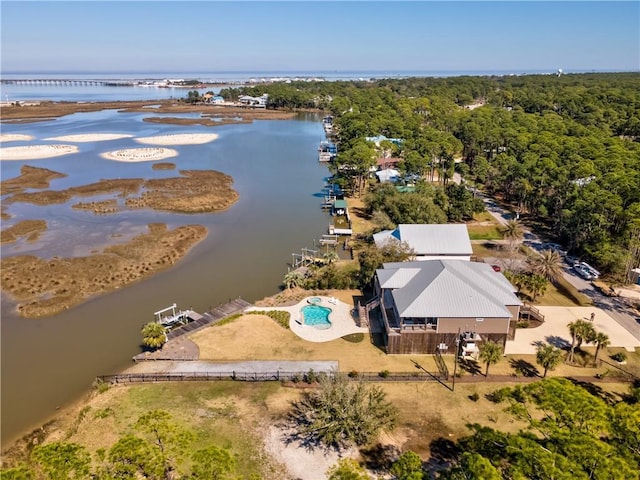 aerial view with a water view and a view of trees