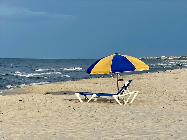 view of water feature with a beach view