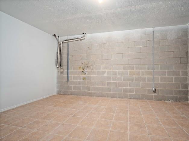 basement with a textured ceiling