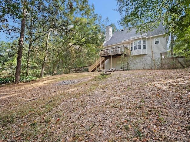 view of yard featuring a wooden deck