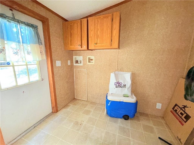 laundry room with washer hookup and cabinet space