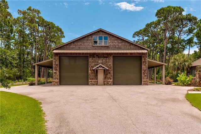 view of property exterior featuring aphalt driveway and an outdoor structure