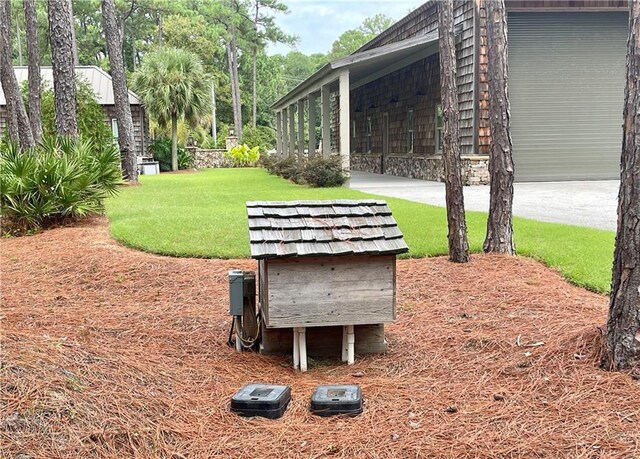 view of home's community with a yard