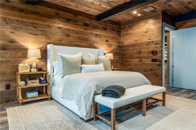 bedroom featuring wood ceiling, wood walls, hardwood / wood-style flooring, and beam ceiling