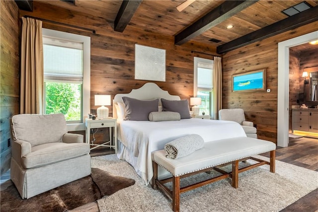 bedroom featuring wooden ceiling, wood walls, wood finished floors, and beamed ceiling