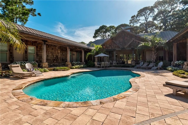 view of pool featuring a patio area