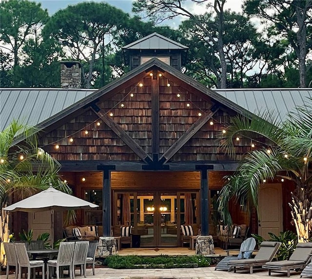 rear view of property featuring a patio area and french doors