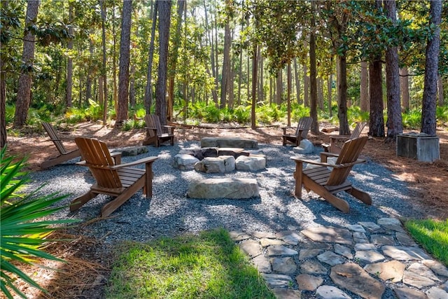 view of patio / terrace featuring an outdoor fire pit