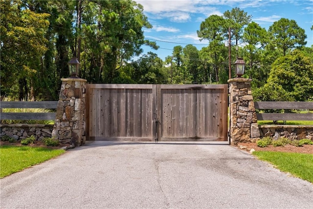 view of gate with fence