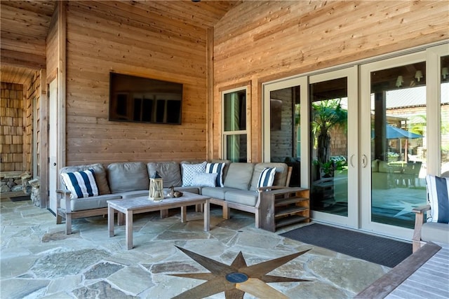 view of patio with an outdoor living space and french doors