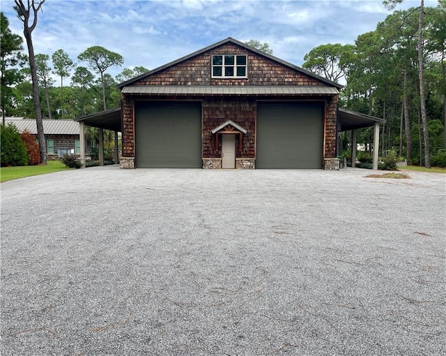 garage featuring aphalt driveway