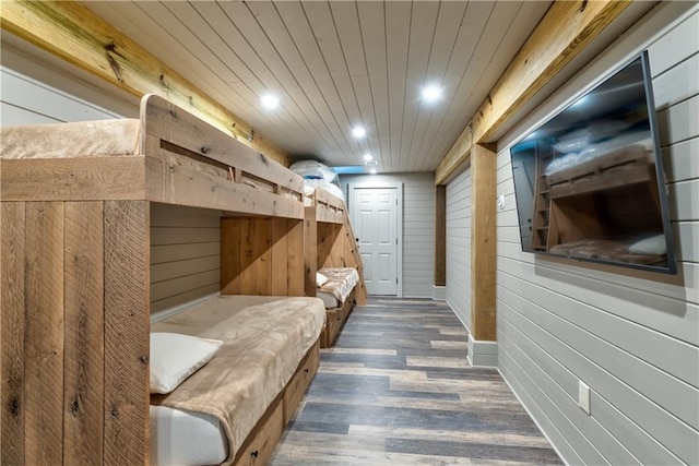 mudroom with wood walls, wood ceiling, dark wood-style flooring, and recessed lighting