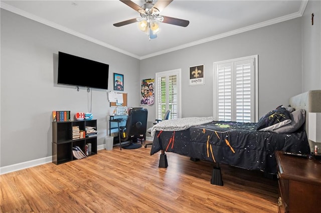 6905 Providence Estates Dr N, Mobile, AL 36695 - bedroom with wood finished floors, ornamental molding, and ceiling fan