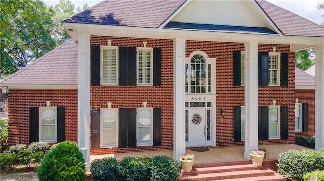 6905 Providence Estates Dr N, Mobile, AL 36695 - view of front of property featuring roof with shingles, brick siding, and covered porch