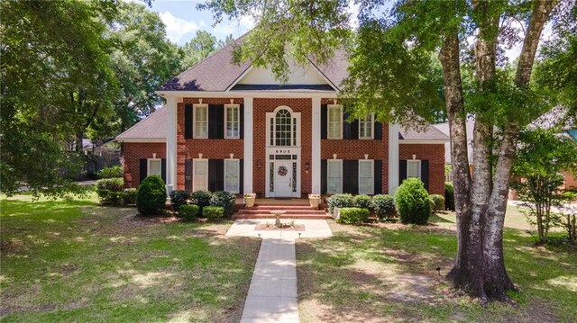 6905 Providence Estates Dr N, Mobile, AL 36695 - neoclassical / greek revival house featuring brick siding and a front yard