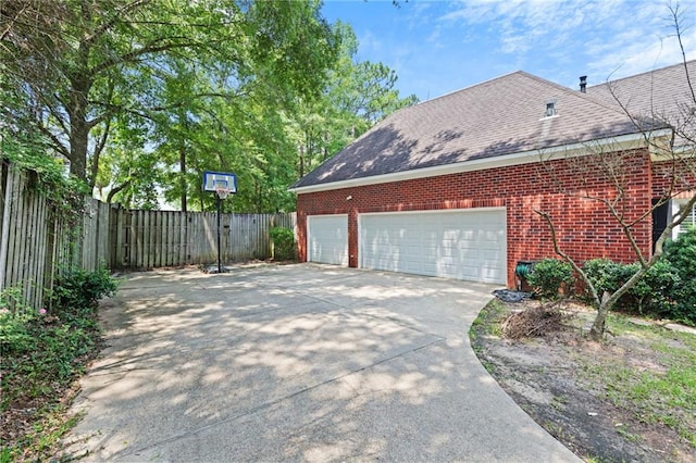 6905 Providence Estates Dr N, Mobile, AL 36695 - view of side of property featuring concrete driveway, a garage, brick siding, and a shingled roof