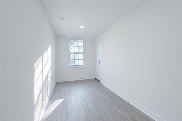 unfurnished room featuring light hardwood / wood-style flooring