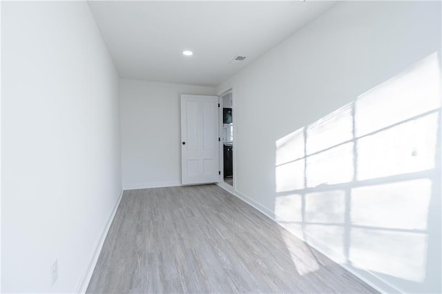 empty room with light wood-type flooring