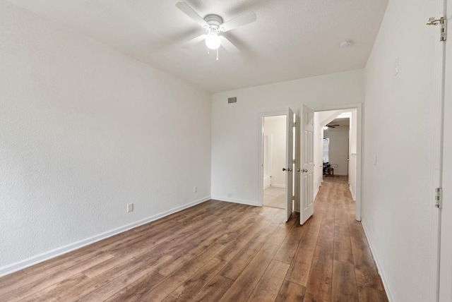 unfurnished bedroom with hardwood / wood-style flooring and ceiling fan